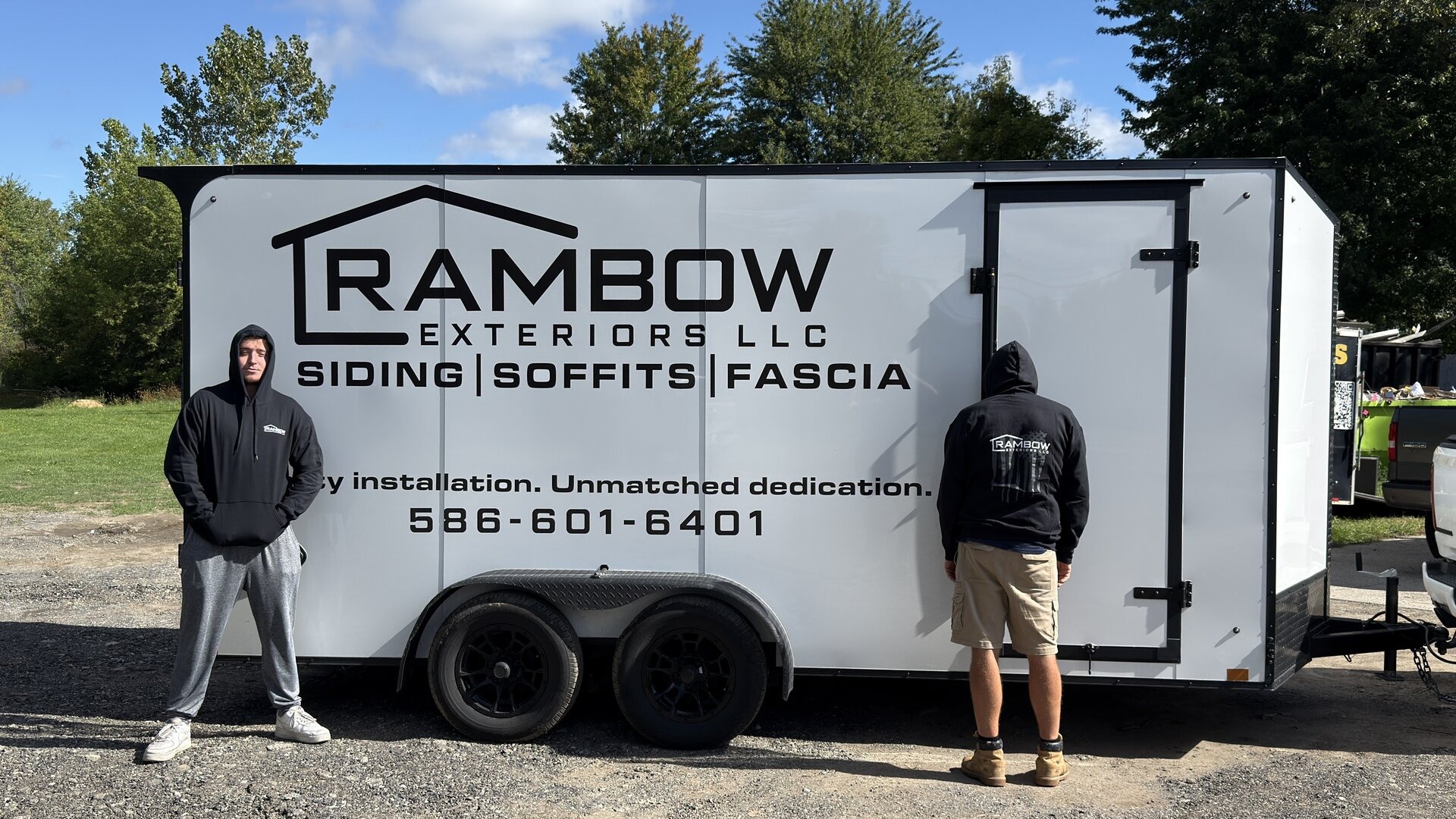 Tyler Rambow and his crew in front of the Rambow Exteriors trailer