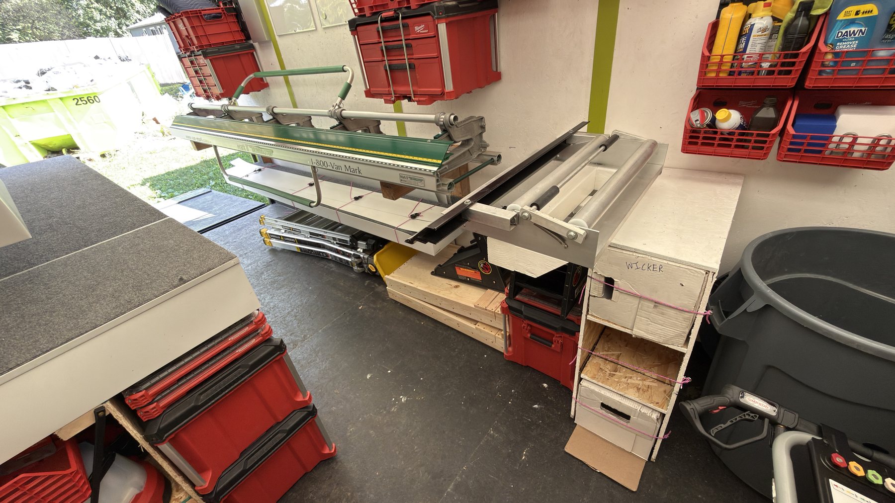 Sheet metal brake and cutting station mounted inside the Rambow Exteriors trailer